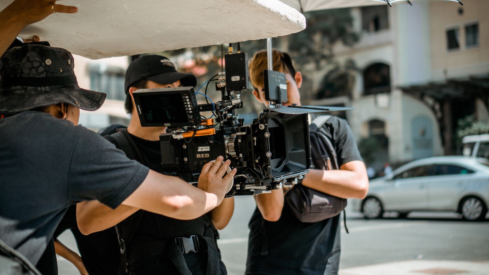 A creator's crew shooting content on a professional cinema camera
